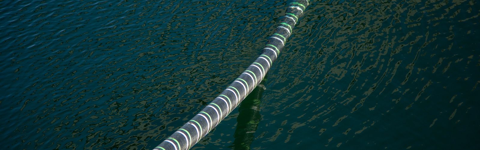 Cable Hanging Over Sea Water