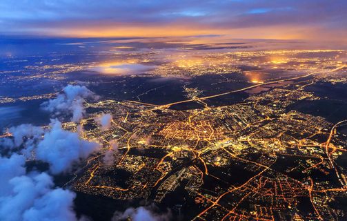 A city lit up at night shown from high above