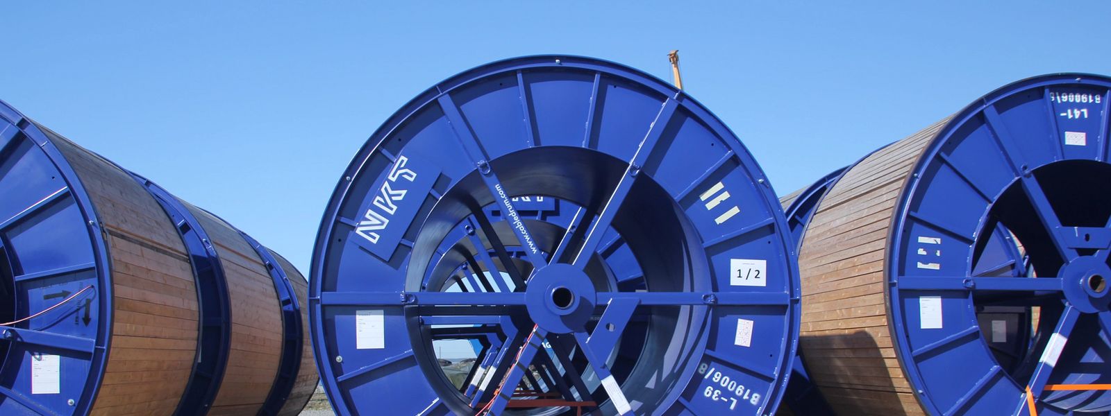 Cable drums under blue sky